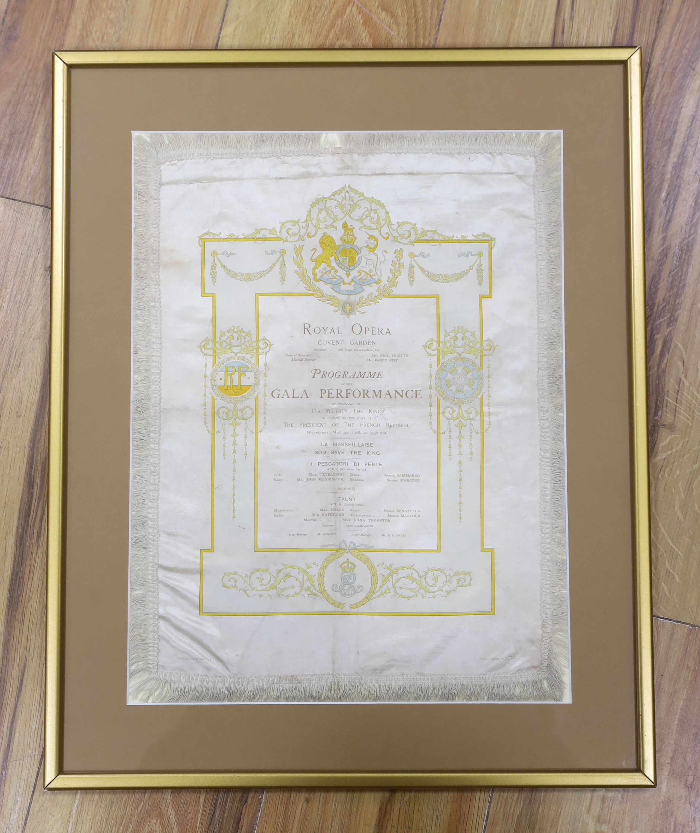 A framed early 20th century silk opera programme, Royal Opera House Covent Garden, Gala Performance 27th May 1908, printed by Finden Brown & Co., 38 x 28cm not including fringe